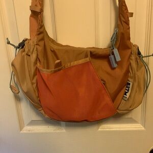 Baboon to the Moon Crescent Crossbody Bag in Desert Brown